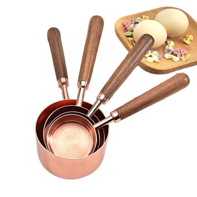 China Sustainable High Quality Copper Plated Wooden Handle 4pcs Measuring Cup for sale