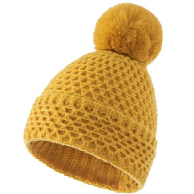 China COMMON Custom Women Winter Cute Pompom Comb Knitted Beanie Hat Thick Soft Snow Knit Skulled Ski Cap With Pom Pom for sale