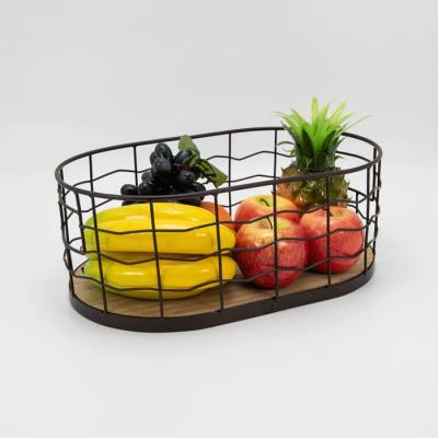 China Viable Wholesale Household Organizer Metal Basket Bread Wire Bags Kitchen Fruit Wooden Bottom Laundry Storage Baskets for sale