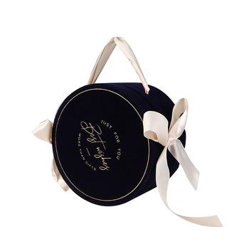 China Retail Premium Recyclable Round Wedding Favors Velvet Gift Boxes With Ribbon Handle for sale