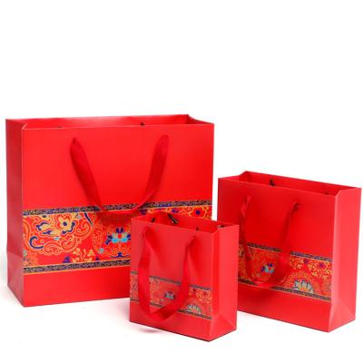 China Recyclable Luxury Red Wedding Gift Bag China Wedding Gift Paper Bag Packaging for sale