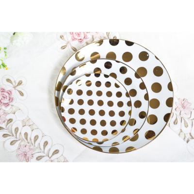 China Sustainable White Ceramic Dinnerware Set Round Shape Table Plates With Polka Dot for sale