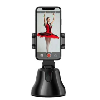 China Large Adjustable Actions Smart Rotation Auto Selfie Phone Stand Selfie Face Pursuit Cell Phone Holder for sale