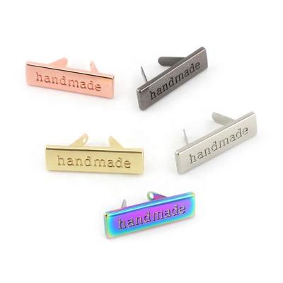 China Metal Connector Clasp With Screw Nolvo World 36*10mm Customized Rainbow Colored Logo Engraved Metal Tag Metal Brand Plate For Bag for sale