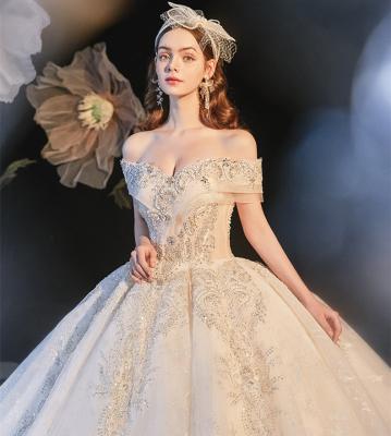 China Elegant Anti-wrinkle fashion off the shoulder champagne one-shoulder sequin princess style tow wedding dress new field of the shoulder wedding dresses for sale