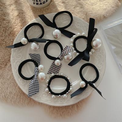 China New Korean Luxury Bow Hair Accessories Black Pearl Scrunchies Elastic Hair Bands For Women Girls Hair Accessories for sale