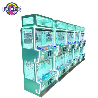 China Transparent Arcade Crane Machine Mini Arcade Gift Machine 4 Player Toy Claw Crane Game Machine for sale