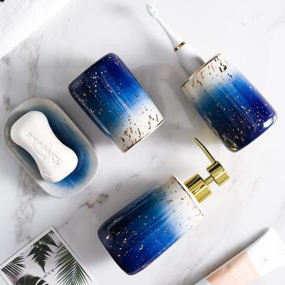 China Sustainable Gold Star 6 Piece Ceramic Bathroom Accessories Set Light Blue And Blue With Gold Spout With Radian for sale