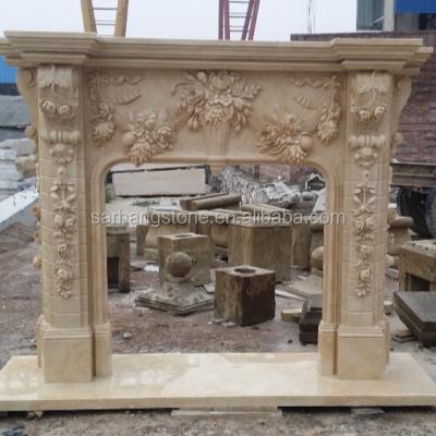 China Home decor interior hand - carved natural beige cream color antique marble fireplace fixed to stone wall for sale