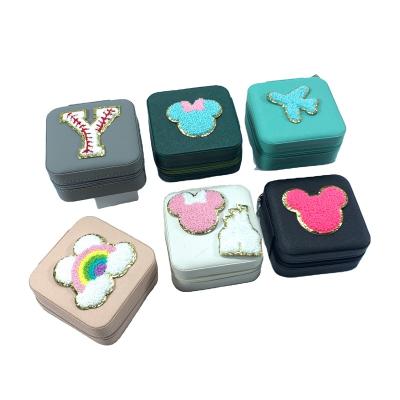 China Hot Sale Fashion Stock Women Girls Ear Studs Box Organizer Portable Jewelry Storage Case PU Leather Small Travel Jewelry Boxes for sale