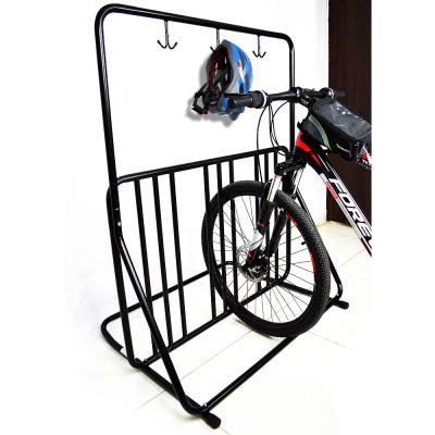 China Double sided steel multicapacity grid mtb bike rack stand straight with helmet mount for sale