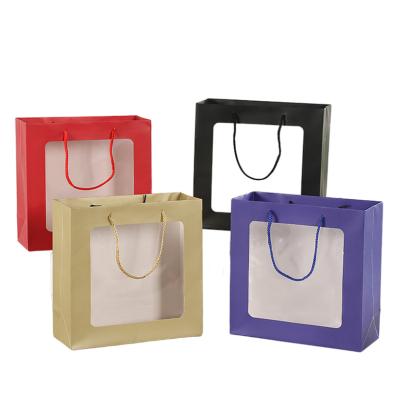 China Recycled Transparent Paper Bag Low Cost Materials Baby Dress Skin Care Open Window Gift Bag for sale