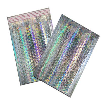 China Strong Adhesive/Shock-resistance/Waterproof/Nice Printing Customized Shiny Foil Holographic Ribbon Adhesive Bubble Cushioned Mailer Envelopes for sale