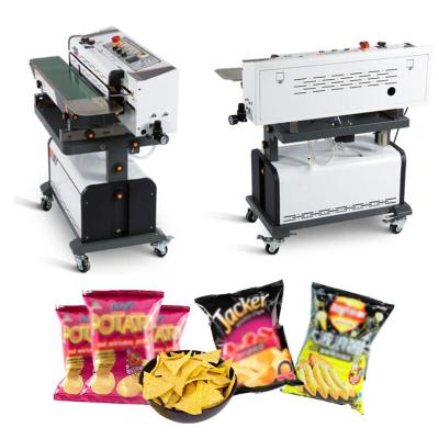 China Commercial continuous food vacuum sealing machine with inflated nitrogen for sale