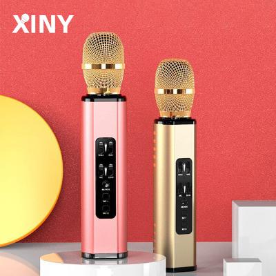 China Wireless Karaoke Mic Speaker Karaoke Xiny Portable Wholesale Blue Tooth Phone Microphone Handheld Microphone for sale