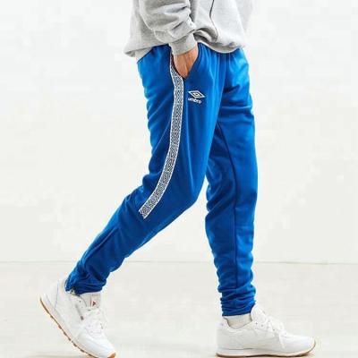 China OEM anti-pilling tapered retro polyester track pants with woven logo taping for sale