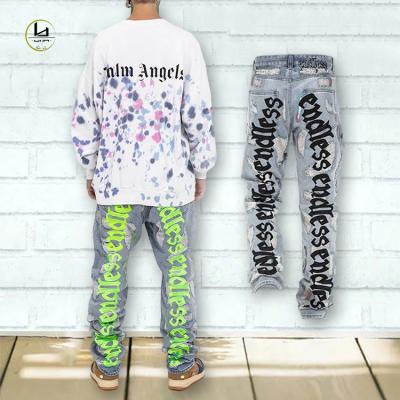 China Factory Sale Personality Men's Breathable Denim Ripped Jeans Wholesale Shredded Retro Logo Damaged Alphabet Embroidery Jeans Customized for sale