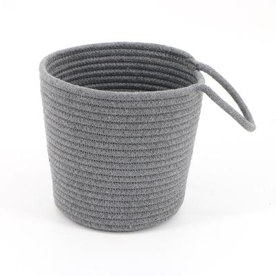 China Sustainable Small Decorative Cotton Rope Flower Plants Basket Hanging Woven Wall Basket Decor for sale