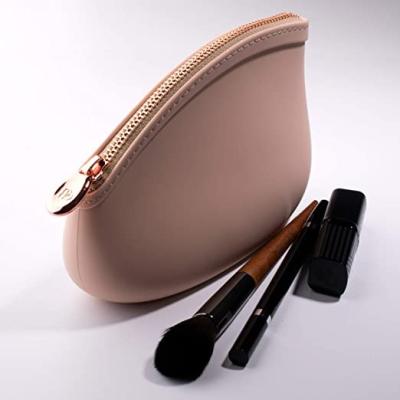 China Small Durable Lady Makeup Bags Squeeze Silicone Zero Bag Waterproof Wallet Travel Makeup Bag for sale