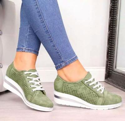 China 2021 New Fashion Faux Leather Lightweight Hollow Out Wedge Heel Sneakers Women Lace Up Perforations Sneakers for sale