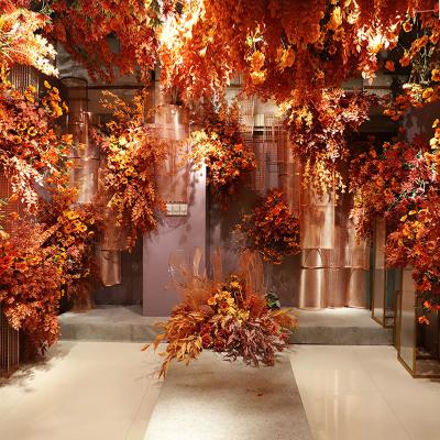 China Beautiful factory direct sale wedding hotel lobby soft decoration romantic orange red silk flower colorful simulation flower stage wall for sale