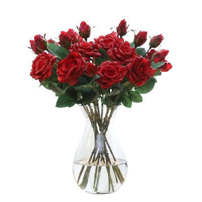 China Beautiful colorful factory direct sales hold moisturizing artificial roses hotel decoration bouquet photography props show silk flowers for sale