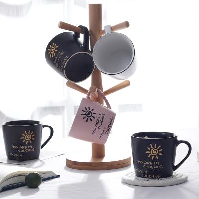 China Sustainable coffee mug set milk mug in matte color with sun artwork set 6 mugs with wooden stand for sale