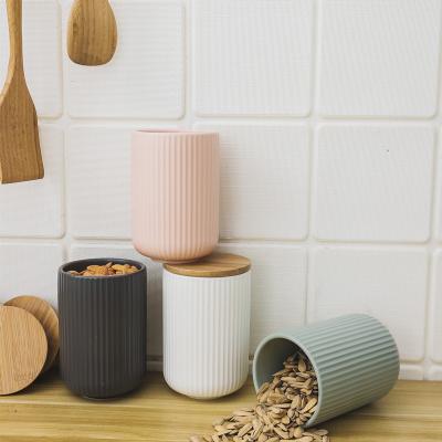 China Viable Most Popular Large Capacity Color Glazed Stoneware Food Kitchen Storage Containers Ceramic Jars With Bamboo Lid for sale