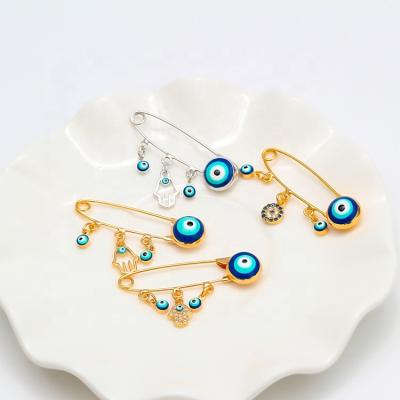 China Simple Necklace Pin Brooch For Kids Gold Charm Safety Brooch Diamond Crystal Collar Pin Evil Eyes Blue Eye Palm Turkey New Style Cloth Decoration Party Wedding for sale