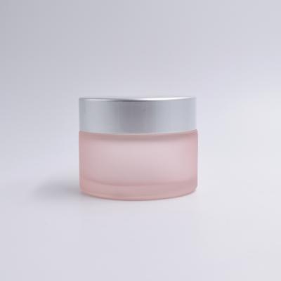 China Personal Care 30g Frosted Pink Custom Cosmetic Wide Mouth Cream Jars Empty Glass Jars For Lotions And Creams for sale