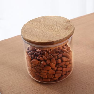 China Wholesale Kitchen Airtight Clear Bamboo Glass Candy Storage Round Glass Storage Jar With Lid for sale