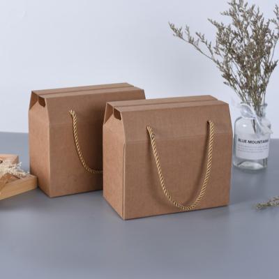 China Biodegradable Custom Food Mooncake Holiday Paper Folding Gift Boxes Folding Dried Fruit Portable Gift Corrugated Box With Handle for sale