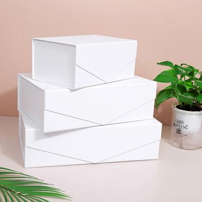 China Para Decoracion De Flores Recyclable Clamshell Custom Packaging Para Wine Paper Folding Creative White Color V-shaped Gift Box for sale