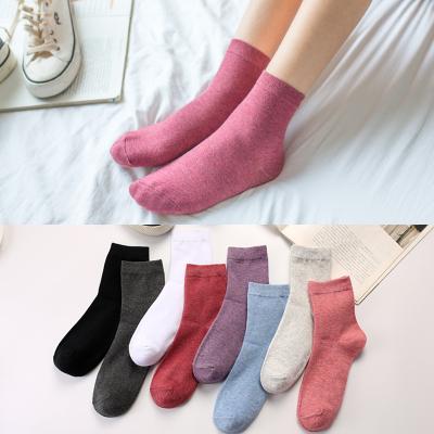 China QUICK DRY socks autumn and winter ladies cotton four seasons in the tube women socks solid color black white socks for sale