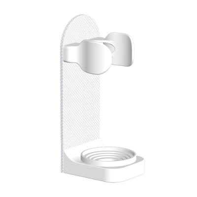 China Sustainable Self Adhesive Wall Mounted Electric Toothbrush Holder Hanger for sale