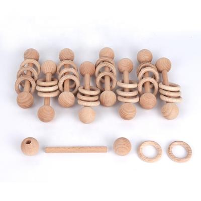 China Toy Montessori Infant Wood Rings Inflatable with Grasping Rattle Engraved Logo Toddler Natural Wood Teething Shaker Ring for Newborn for sale