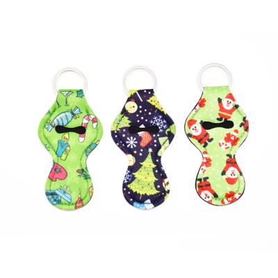 China 2021 Colorful Promotion Gift Christmas Special Design Pattern Neoprene Key Chain Chapsticker Holder Sleeve In Stock for sale