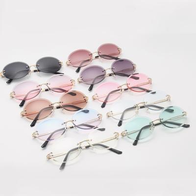 China 2021 Hot Selling Oval Sunglasses Women Rimless Colorful Vintage Eyewear Eyewear Kenbo Sunglasses for sale