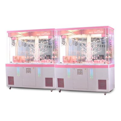 China New Attractive Appearance Design Guangdong Doll Claw Machine 2 Users Easy To Grip Pink Clip Decoration Toy Machine For Market for sale