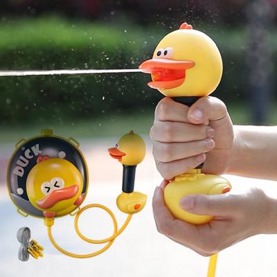 China Pump Neck 2022 New Kids Outdoor Game Design Long Range Water Spray Duck Toys Cartoon Duck Backpack Water Gun Toy For naughty children for sale