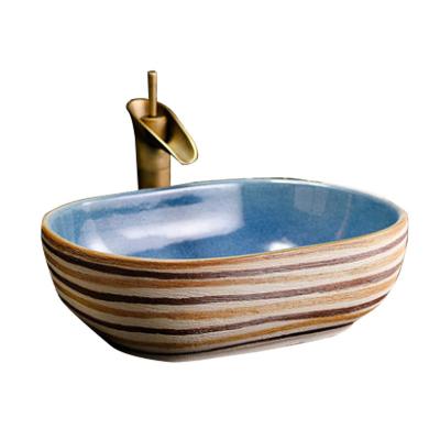 China Modern Design 1300 Degree Fired Chinese Hand Carved Art Blue Color Glazed Ceramic Washroom Wash Basin for sale