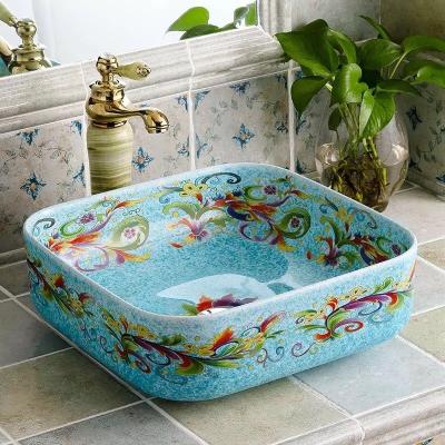 China Modern Blue Color Glazed Ceramic Wash Basin Fired 1300 Degree Chinese Style Flower Design Artistic Bathroom Vessel Sink for sale