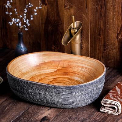 China 1300 Degree Fired Jingdezhen Wholesale Hand Maded Brown And Gray Color Art Ceramic Oval Bathroom Hand Sink Price for sale