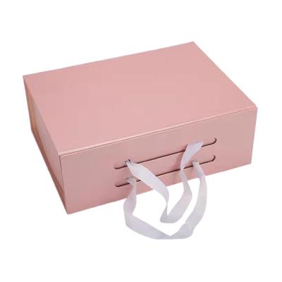 China Recyclable Luxury Foldable Rigid Paper Pink Gift Box Packaging Custom Cardboard Magnetic Baby Gift Box With Ribbon for sale