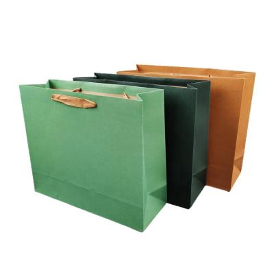 China Boutique Recyclable Custom Carrier Packaging Foldable Reusable Paper Bag Paper Shopping Bag With Logo en venta