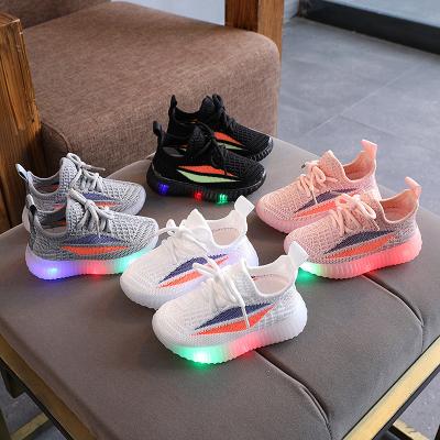 China New light fashion boy girls walking running sneakers kids white pink black sports light up kids shoes for sale