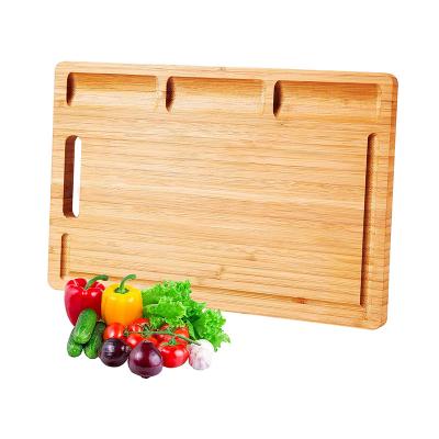 China Durable Sustainable Kitchen Chopper For Bread Meats Fruits With Deep Juice Groove Cutting Board 100% Organic Bamboo for sale