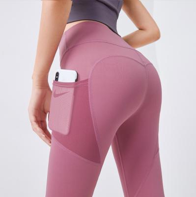 China Breathable High Waist Sport Fitness GYM Workout Clothes Sexy Smile Tights Seamless Butt Lift Women Yoga Pants Leggings With Pockets for sale