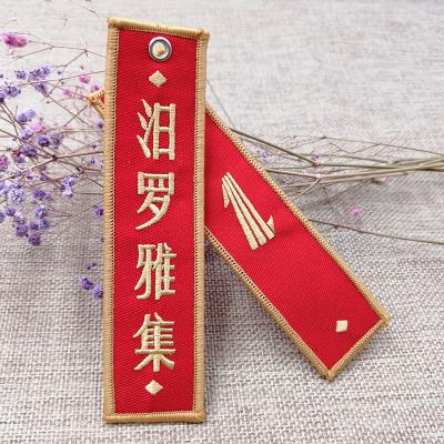 China Embroidered Custom Embroidered Keychain Key Chain Flight Key Chain Fabric Pilot Embroidered Tag For Car Motorcycle Bag Cat Key Chain for sale