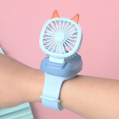 China Portable Electric Mini Watch Wireless Charging Fan New Trend Fan In Hand USB Desktop Fan for sale